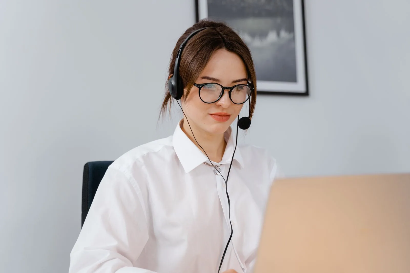A support representative answers questions by headset.
